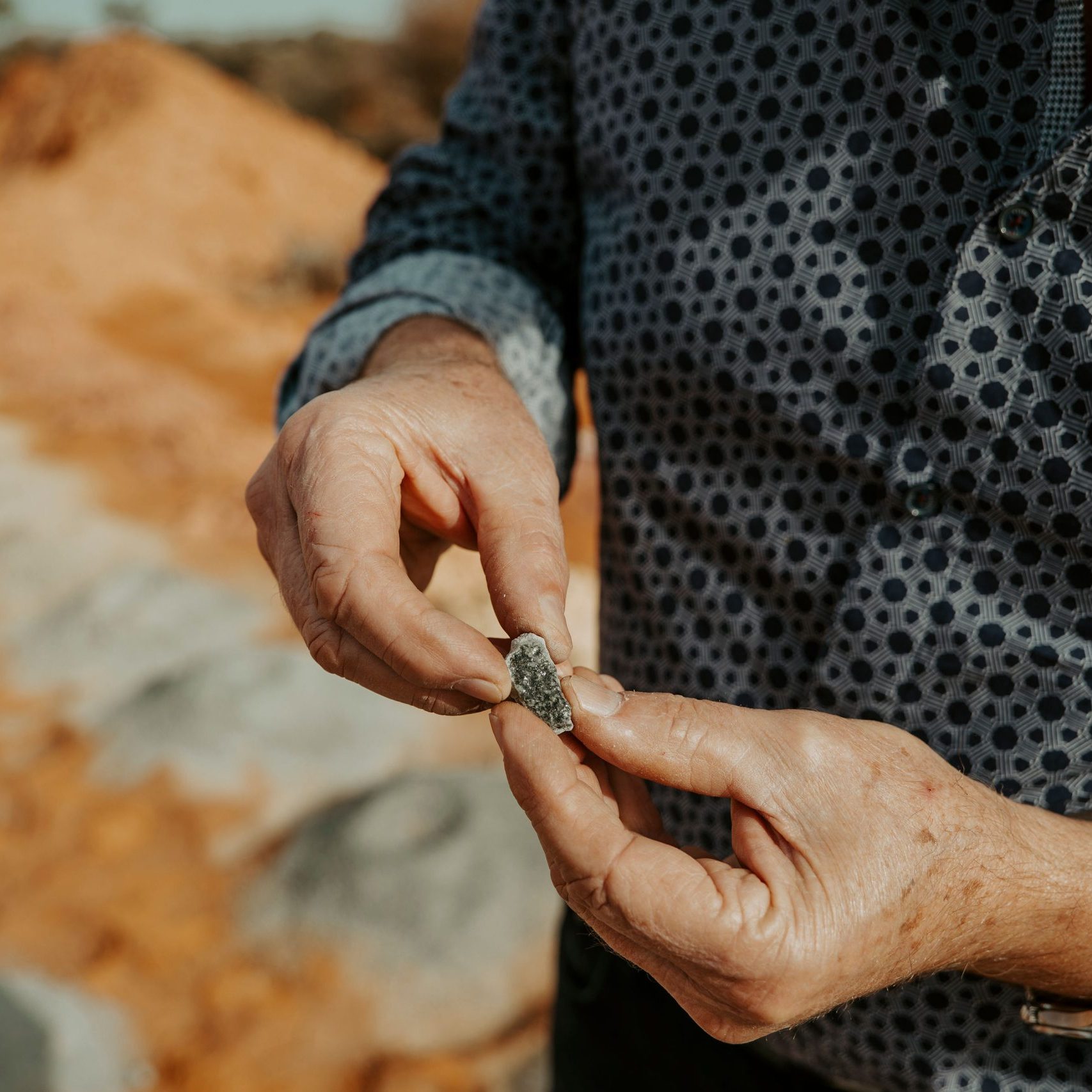 Geologist inspect samples in Western Australia